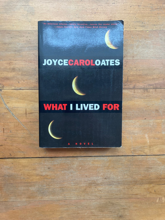 What I Lived For by Joyce Carol Oates. Plume Books. 1994.